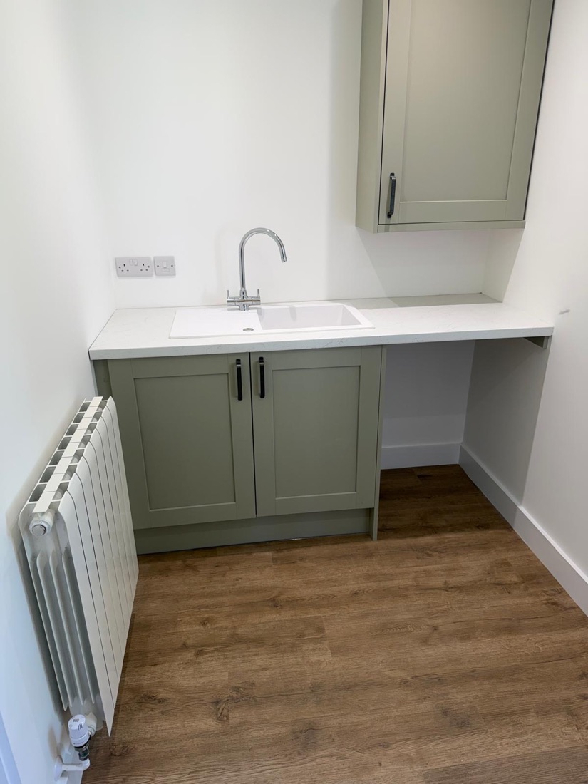 Utility room sink, tap and radiator installation