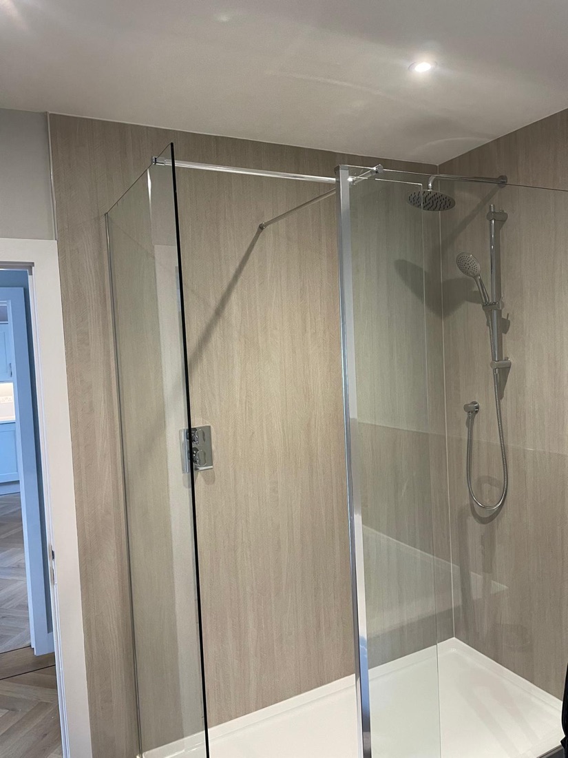 Walk-in shower with rainfall and handheld heads